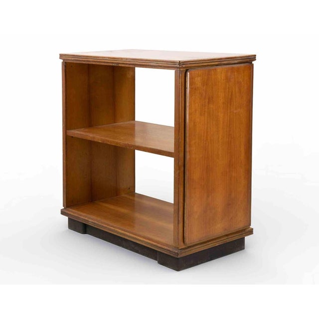 Solid and veneered wood, stained and varnished; ebonized plinth base. Manufacturer’s label “Anonima Castelli Bologna” to...