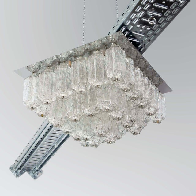 This generously sized ceiling light, attributed to j. T. Kalmar, was created in austria in the late 1960s or early 1970s....