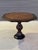 A French Art Deco-style octagonal pedestal center or foyer table crafted from zebrano wood with ebonized detailing and a...