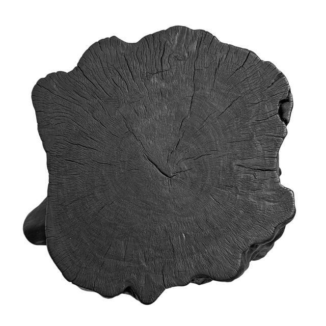Solid lychee wood stump stool or side table. Attractive modern black finish subtly highlighting the natural wood grain....