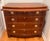 Lovely bowfront banded mahogany bachelors chest with 4 drawers and pull out shelf. Made by Baker Furniture Company, this...