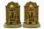 These Art Deco bookends, made by J. B. Hirsch Foundry, depict a scholar sitting on a step ladder reading a book against...