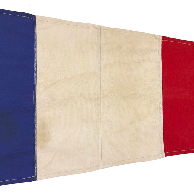 This nautical-style pennant is fully sewn from a cotton cloth salvaged from another vintage flag. All striped seams and...