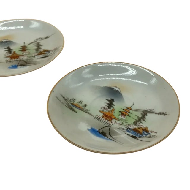 This charming pair of vintage Kutani Japan hand-painted porcelain dishes captures the timeless beauty of traditional...