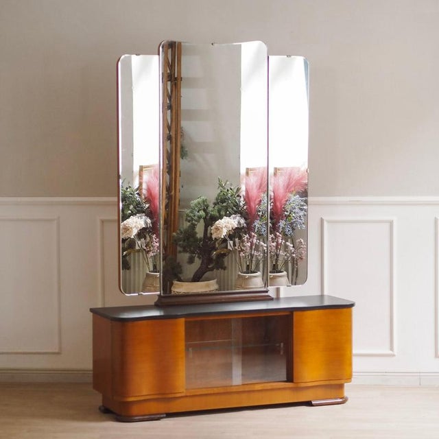 Stylish art deco mirrored cabinet with a striking design, high-quality craftsmanship, and ample storage space. Designed...