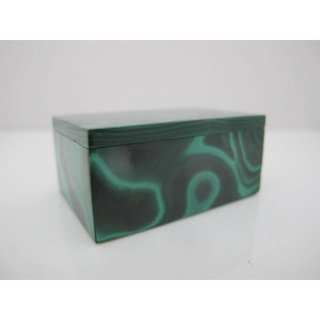 Wonderful miniature Malachite box with lid. Features distinctive green banded patterns and a polished finish. Perfect for...