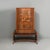 Italian Art Deco inlaid wood bar cabinet, 1930s Inlaid wood bar cabinet. The upper section features a compartment with...
