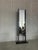 Designer unknown italy, 1980s h 181 w base 63cm d base 28 a striking blend of art and function, this floor mirror with a...