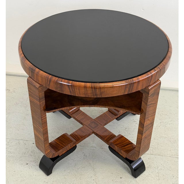 A distinctive Art Deco coffee table dating from the 1930s, showcasing refined craftsmanship and a striking combination of...