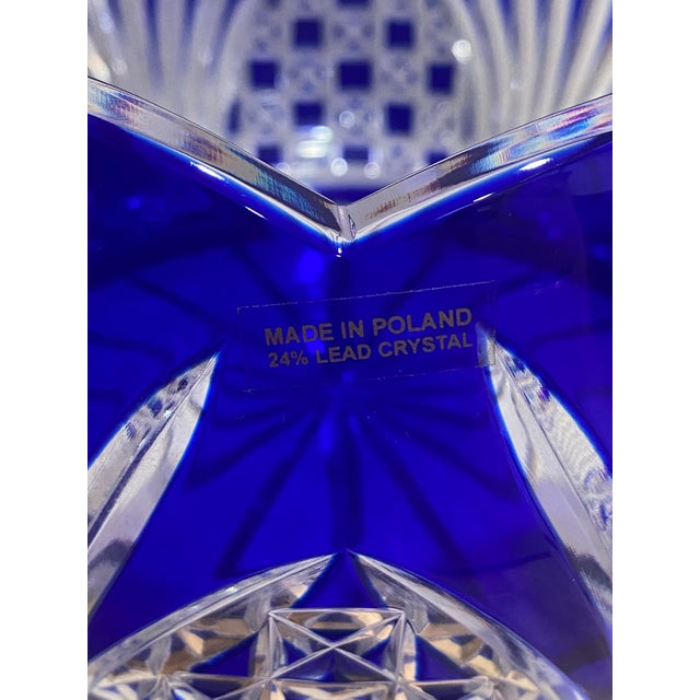 Striking vintage cobalt blue cut-to-clear crystal bowl featuring an intricate hand-cut geometric and fan motif. The rich...