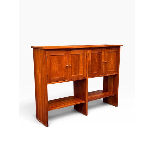 A handsome solid cherry sideboard console in the Shaker-inspired Arts & Crafts idiom associated with Stickley, combining...