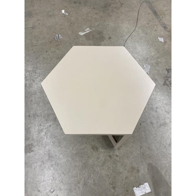 This stylish cocktail table features a taupe finish and a unique hexagonal top, adding a modern, geometric flair to any...