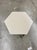 This stylish cocktail table features a taupe finish and a unique hexagonal top, adding a modern, geometric flair to any...