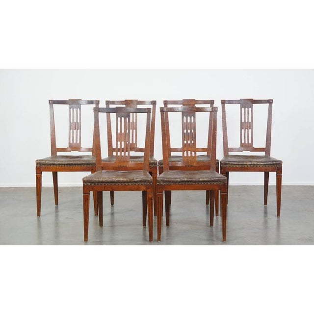 Set of 6 original antique Dutch leather dining room chairs with a beautiful pattern and fantastic colors in the seats....