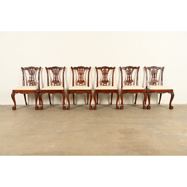 An outstanding set of eight Chippendale or Georgian style dining chairs In the manner of Baker Furniture USA, Circa 1980s...