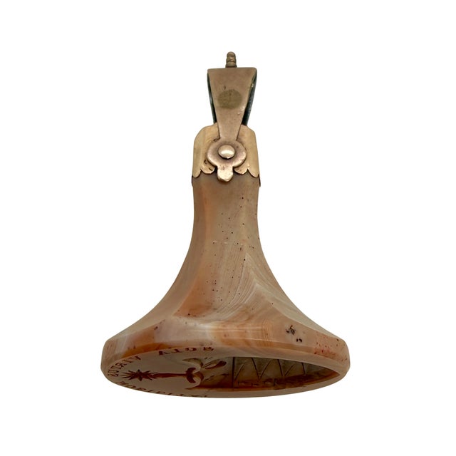 Dating to circa 1820, this fob seal charm pairs a carved banded agate intaglio with warm period 10K gold fittings. The...
