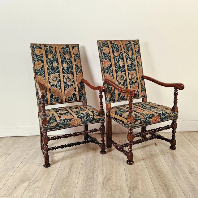 A good pair of Flemish Baroque walnut chairs covered in old tapestry, probably 18th century. Seat height 16.5".