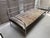 This Bauhaus tubular steel daybed, dating from approximately the 1930s, is a striking example of early modernist furniture...