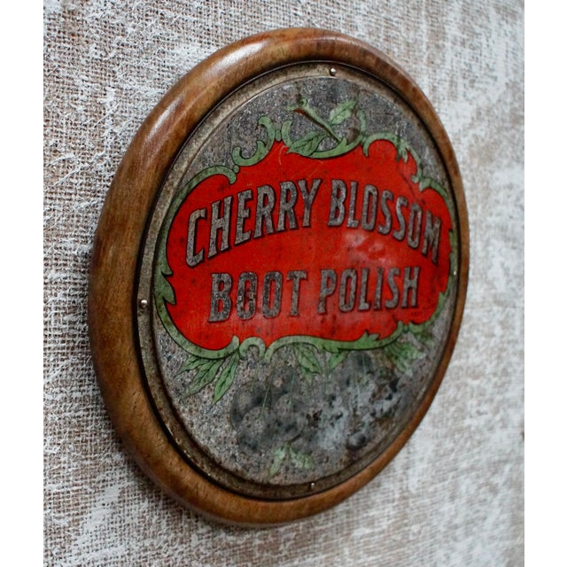 A lovely original cherry blossom boot polish tin advertising sign. Made from tin, mounted on an oak plinth. C1910 cherry...