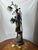 A vintage Art Nouveau sculpture lamp, dating back to around 1900, originally conceived as a pillar lamp. It depicts a...