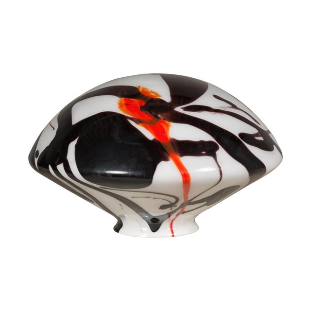 A Midcentury blown glass dome with black, white and orange abstract décor. This midcentury blown glass dome captivates...