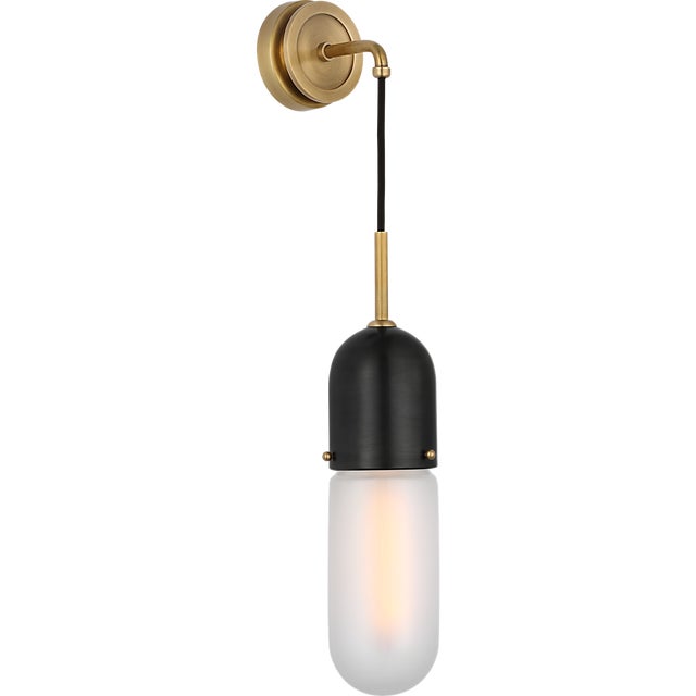 Junio Wall Light in Bronze and Brass with Frosted Glass Designer: Thomas O'Brien Finish: Bronze and Brass Height: 26"...