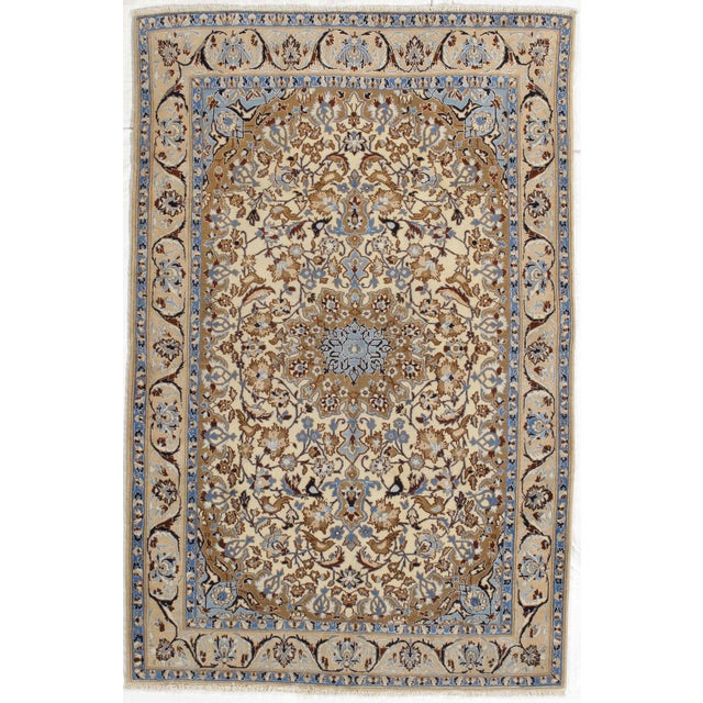 Vintage Hand-knotted Persian Nain rug from central Iran, known for its fine weave and detailed floral designs. Features an...