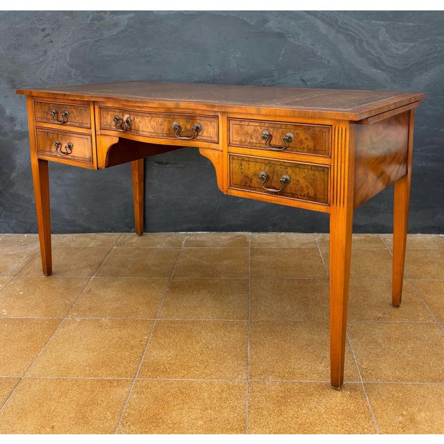 Elegant Georgian Revival writing desk crafted in hardwood, dating to the mid-20th century. The desk features a refined...