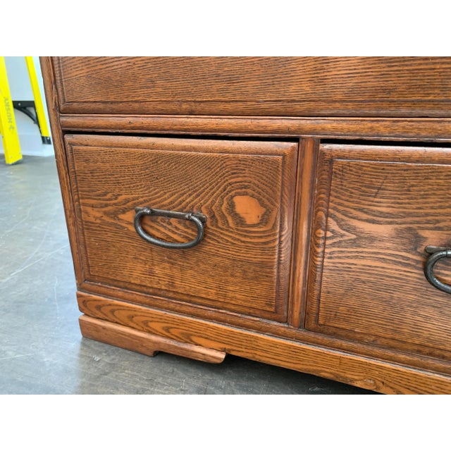 The originals hand wrought iron pulls certainly dates this low cabinet to the turn of the century. We suspect some...