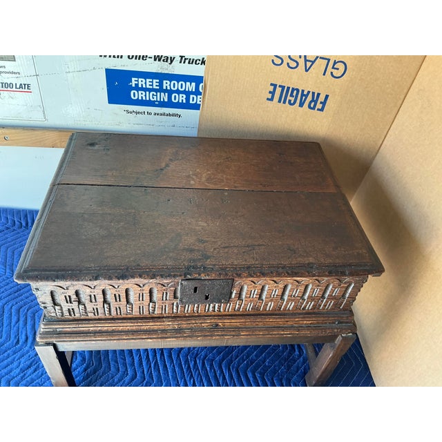 Step back in time with this Gothic Style Antique Carved Oak Travel Chest, a masterful blend of function and medieval...