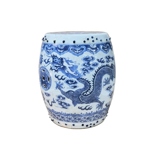 This charming Chinese blue and white porcelain garden stool-form miniature stand features an exceptionally detailed hand-...