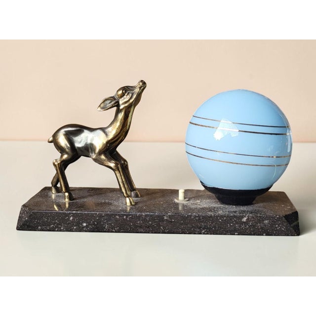 Art Deco Night Light with Fawn, Gilt Spelter and Blue Opaline Glass — France, circa 1930 Charming Art Deco night light...