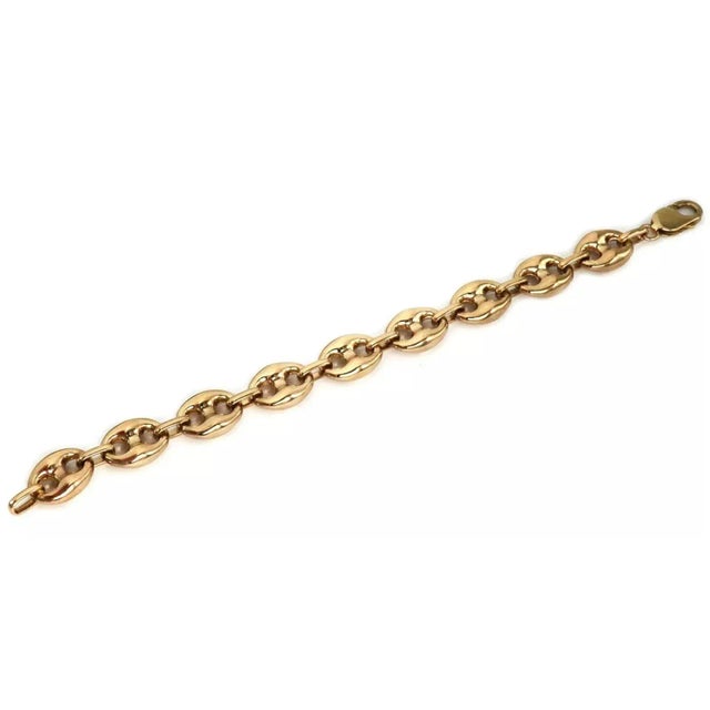 This lovely bracelet is crafted from 14k yellow gold with a high polished finish. The links are large with a puffed style...