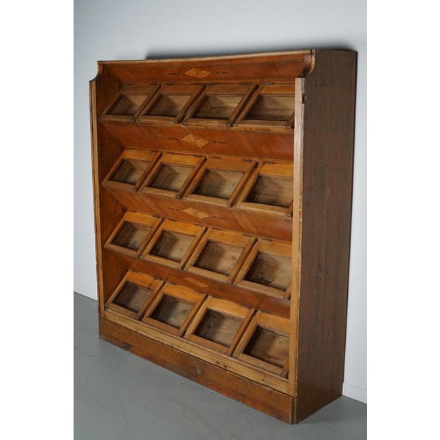This very unique haberdashery / shop cabinet was produced during the 1920/30s in the Netherlands. It features 16...