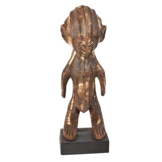 The Kela figures are distinguished by their distinctive and elaborate style. They are characterized by geometric shapes...