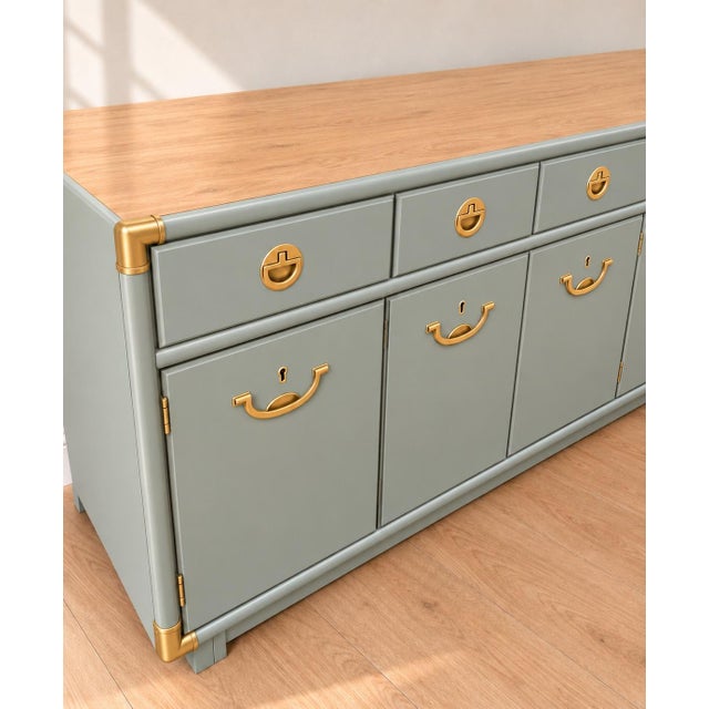 A beautiful American-made vintage sideboard from Drexel’s sought-after Accolade collection, refinished in a custom sage...