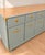 A beautiful American-made vintage sideboard from Drexel’s sought-after Accolade collection, refinished in a custom sage...