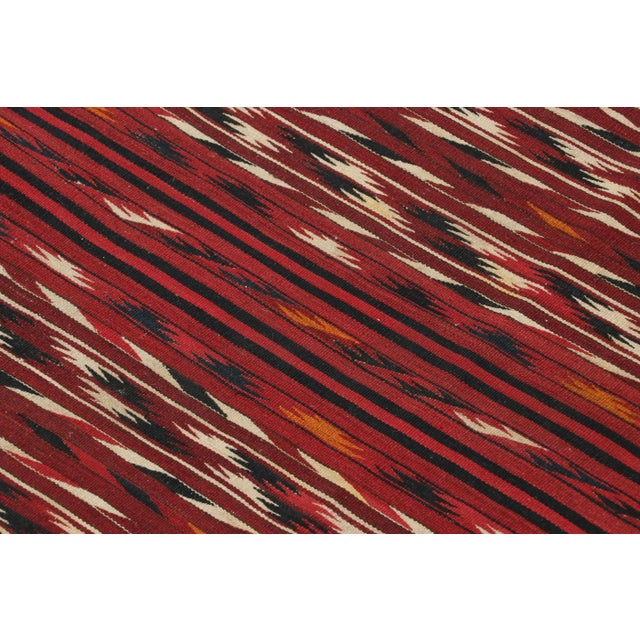 This antique 4x9 Persian kilim runner is a classic tribal rug, handwoven in wool circa 1920-1930. On the Design: The...