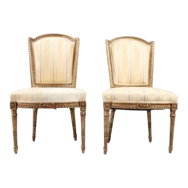 Pair of 19th Century Louis XVI Matching Gilt Wood and Painted Side Chairs in Striped Fabric For Sale