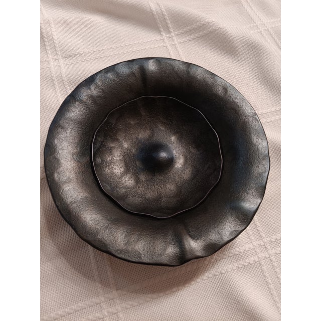 hand forged and hand finished nesting bowls. this set has a stippled finish with a darker blued patina with satin lacquer...