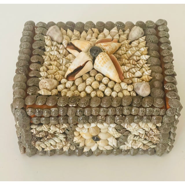 Early 20 th c vintage richly encrusted with vintage sea shells jewelry box with bright orange velvet interior.