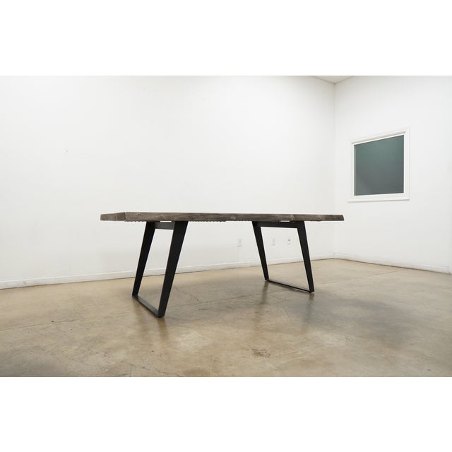 The Yukon Dining Table by Crate & Barrel combines natural wood character with a modern industrial silhouette. Crafted from...