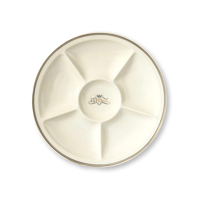 Set of five Danish divided porcelain plates produced for the Astoria Hotel by Bing and Grøndahl. These midcentury service...