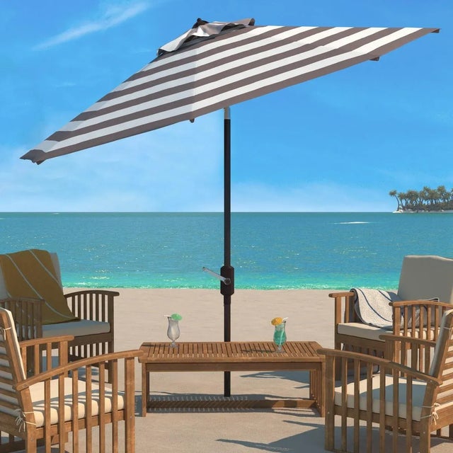Inspired by the cosmopolitan Art Deco hotels in the heart of Miami Beach, this Iris Umbrella is absolutely fashion...