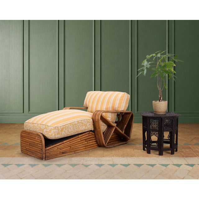 A stylish and rare bent rattan "Pretzel" chaise lounge or chaise longue crafted in a Mid-Century Organic Modern style...