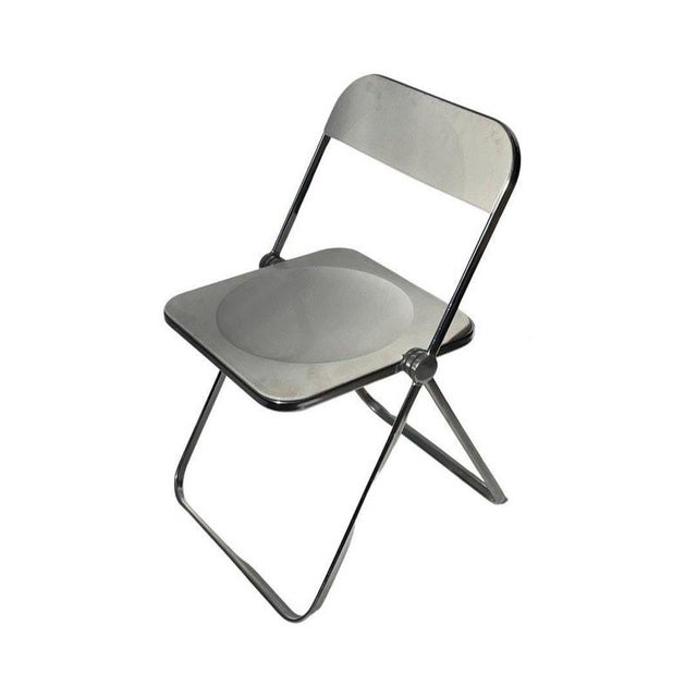 Iconic foldable chair. Designed by Giancarlo Piretti. Made from hard plastic and a plastidipped steel frame. This is the...