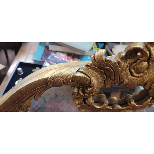 Fine vintage French Rococo style mantle or wall mirror. Featuring beautiful carved wood frame with scrolls, cartouch and...