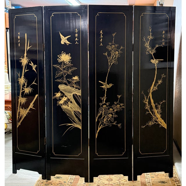 Design Plus Gallery presents a Vintage Asian Four-Panel Folding Screen. The black lacquered wood panels depict robed court...
