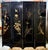 Design Plus Gallery presents a Vintage Asian Four-Panel Folding Screen. The black lacquered wood panels depict robed court...