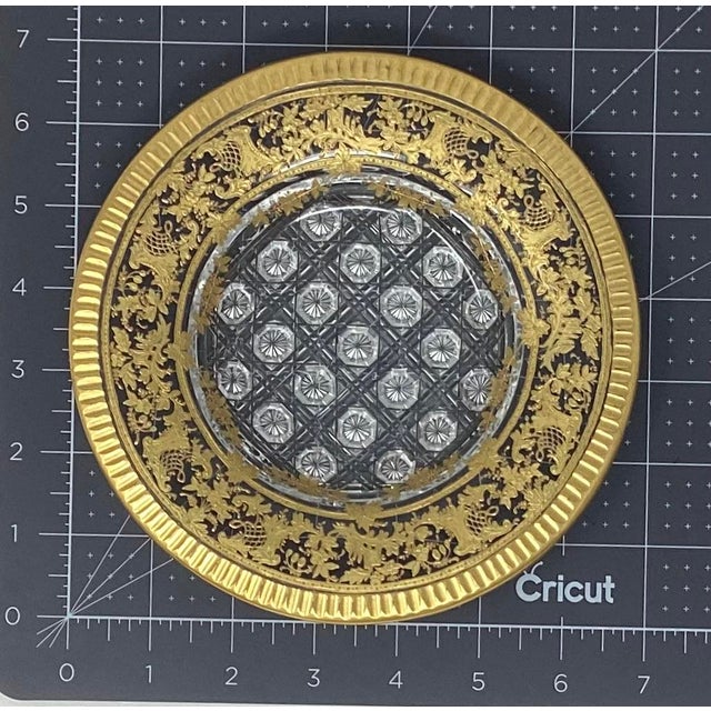 This plate is a beautiful accent or display piece. It has a intricately cut center surrounded by heavy gilding and a...
